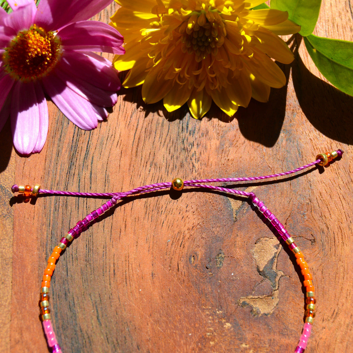 Adjustable, colourful beaded bracelet with silicone stopper bead.