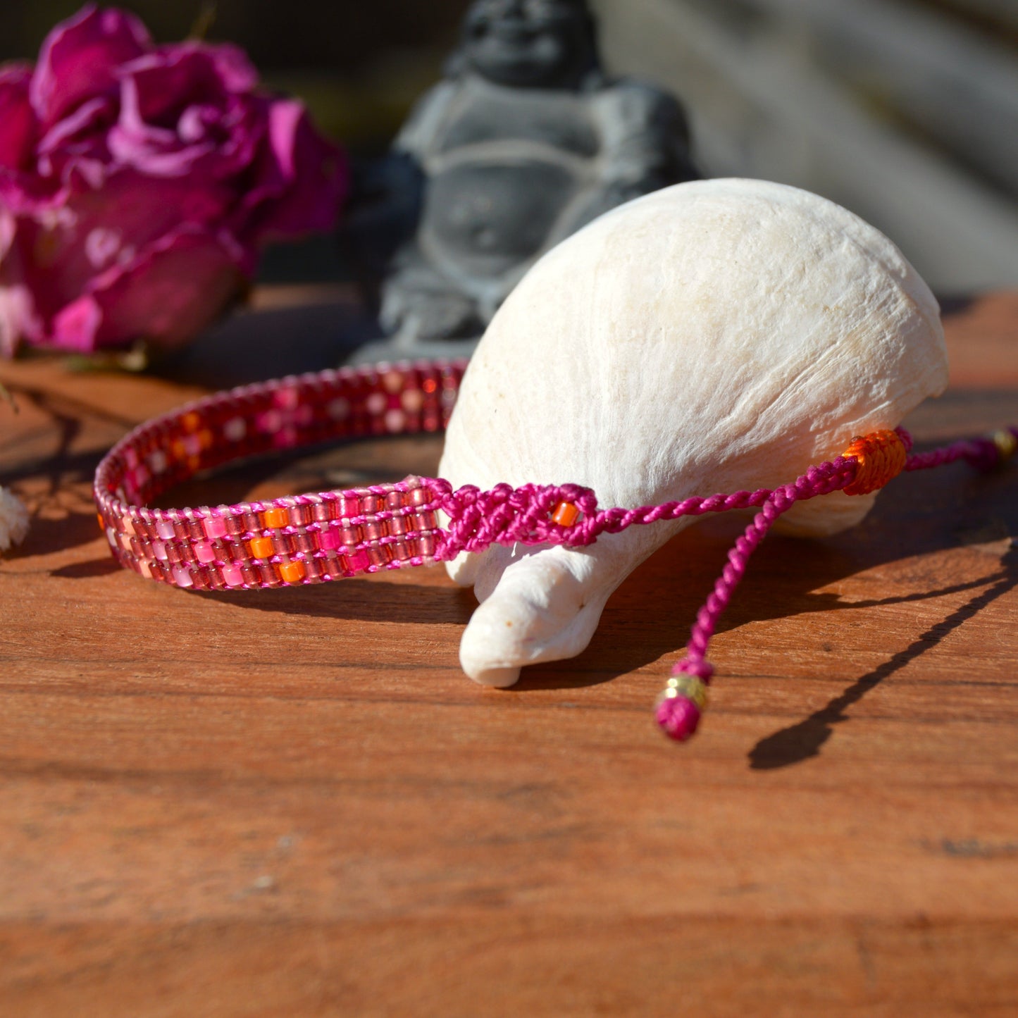 Woven beaded bracelet made of Japanese seed beads with macrame details.