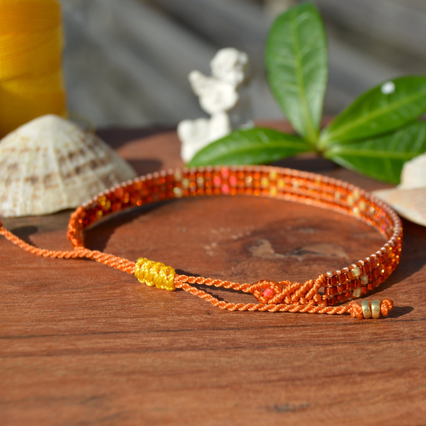 Woven bracelet with Flower design made of Japanese glass seed beads with macrame details.