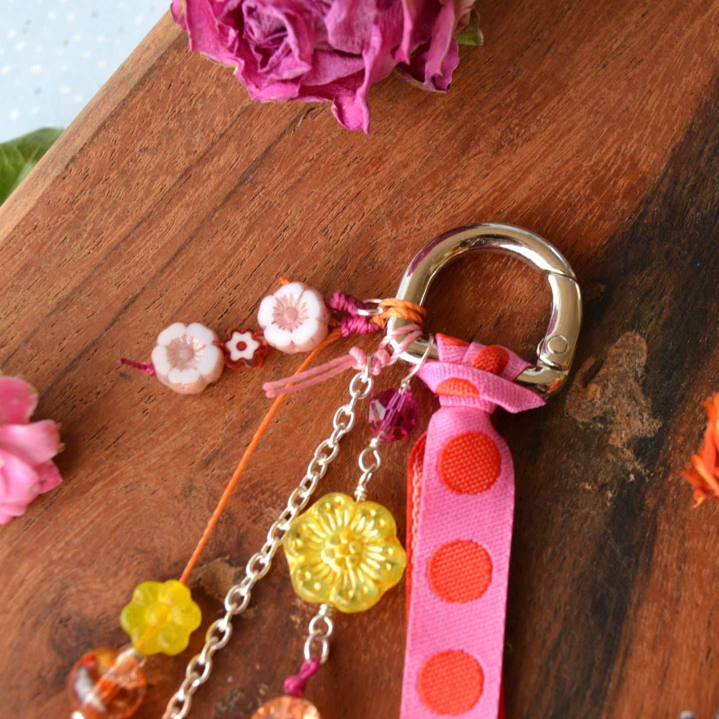 Handbag charm with Czech beads and ribbon in yellow, orange, pink, and red tones.