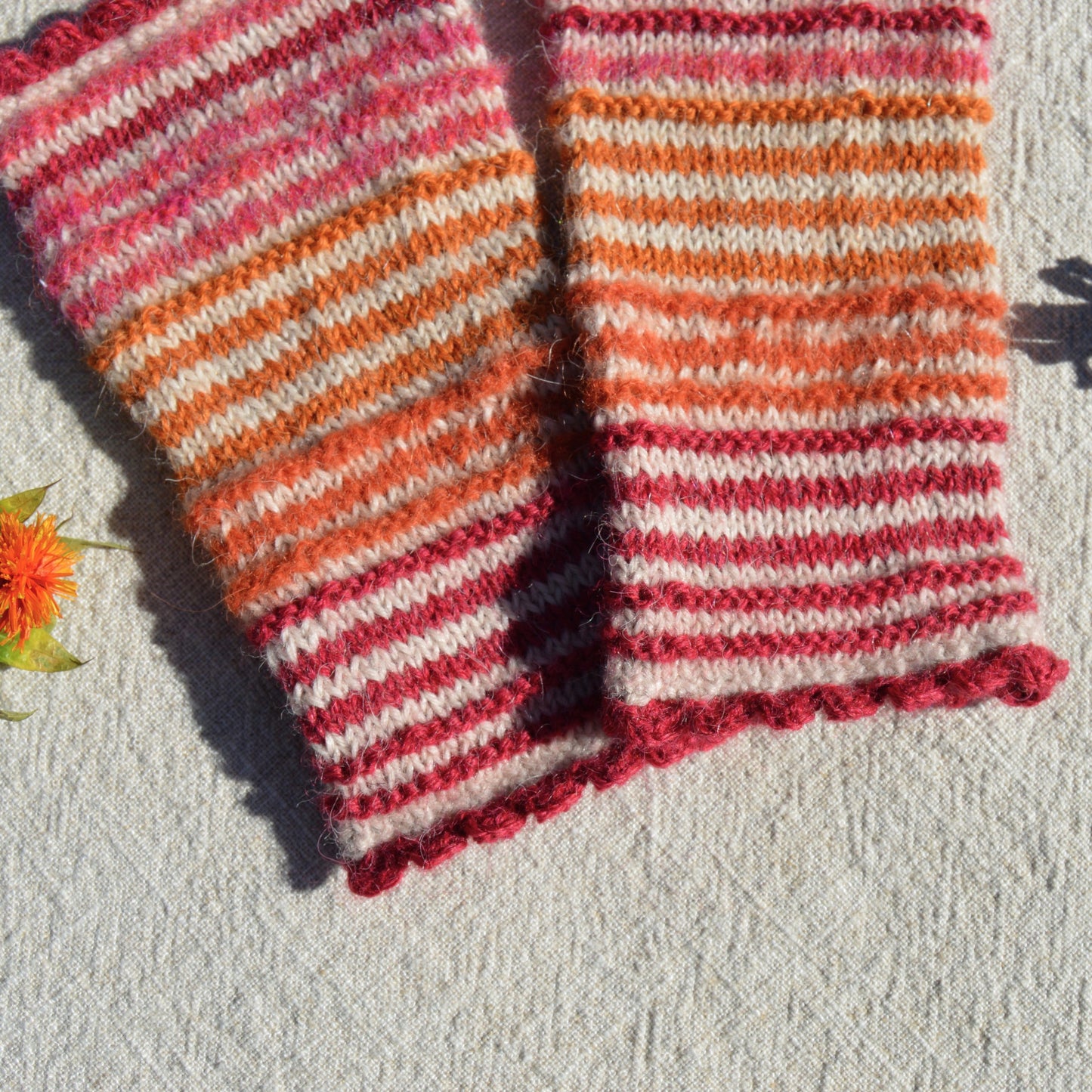 Colourful striped knitted pulse warmers.