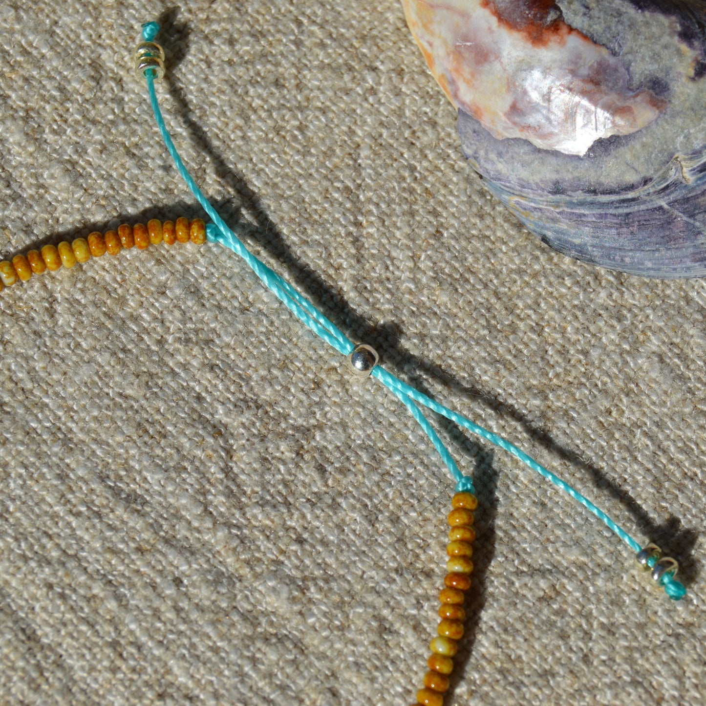 Adjustable seed beads bracelet Closer to the Sea. Silicone stopper bead in sterling silver.
