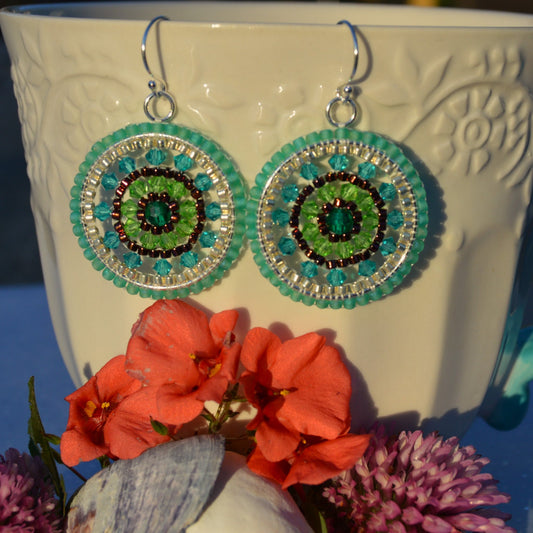 Woven sterling silver earrings in turquoise and green tones.