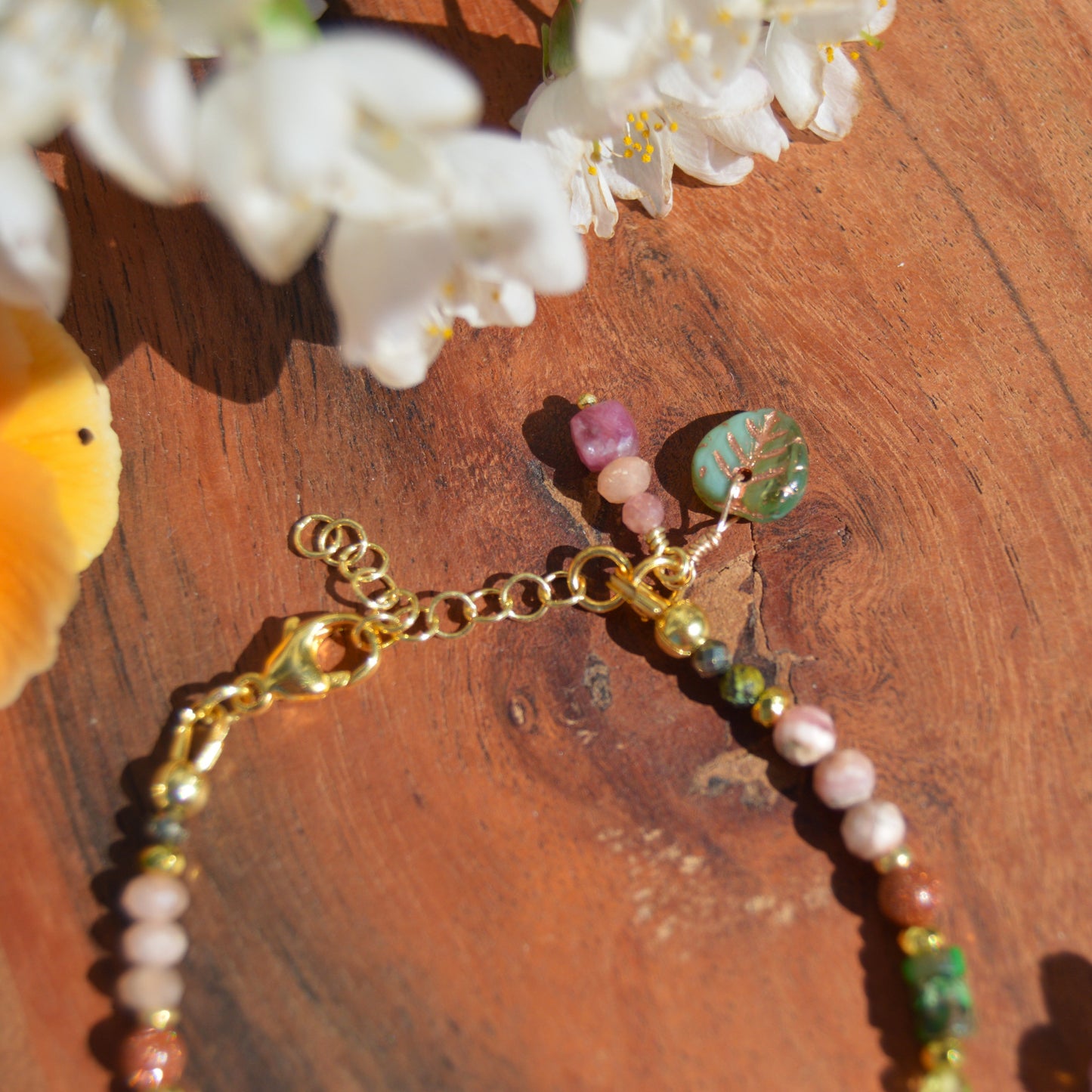 Gold-plated gemstone sterling silver bracelet with Czech glass flower and leaf beads.