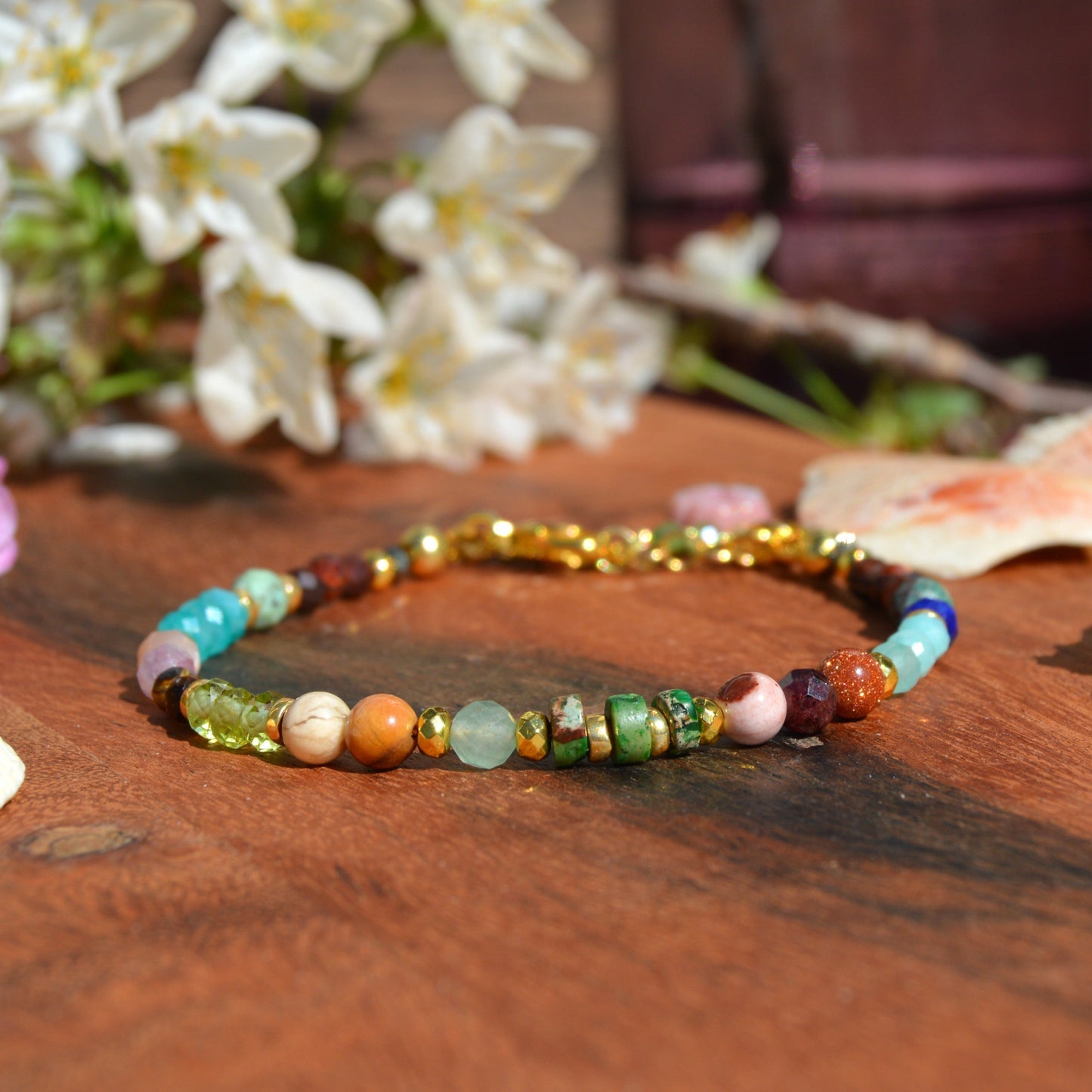 Gold-plated sterling silver bracelet made of colourful gemstones with Czech glass flower bead.