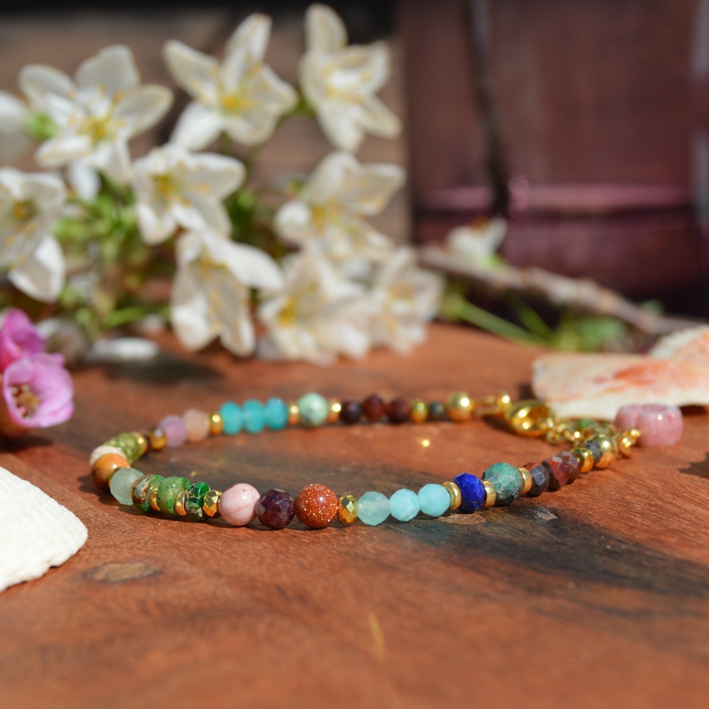Gold-plated sterling silver bracelet made of colourful gemstones with Czech glass flower bead.