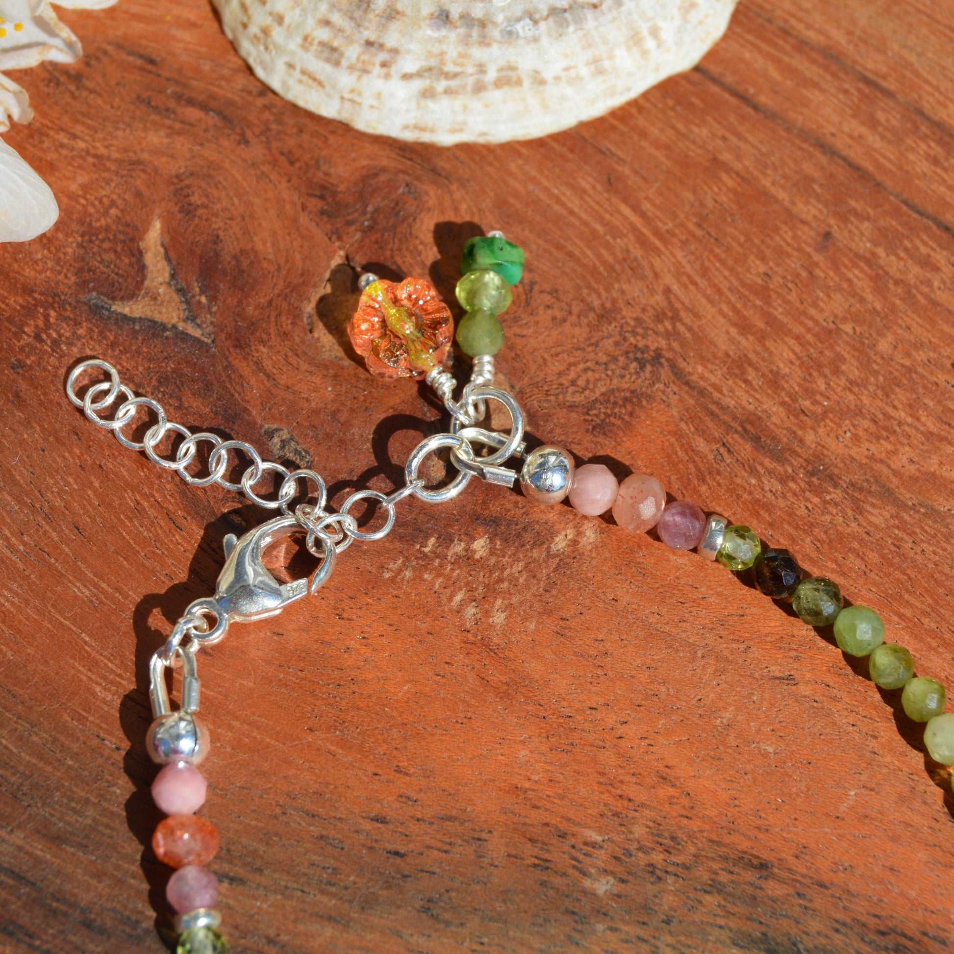 Sterling silver bracelet made of colourful gemstones with Czech glass flower beads.