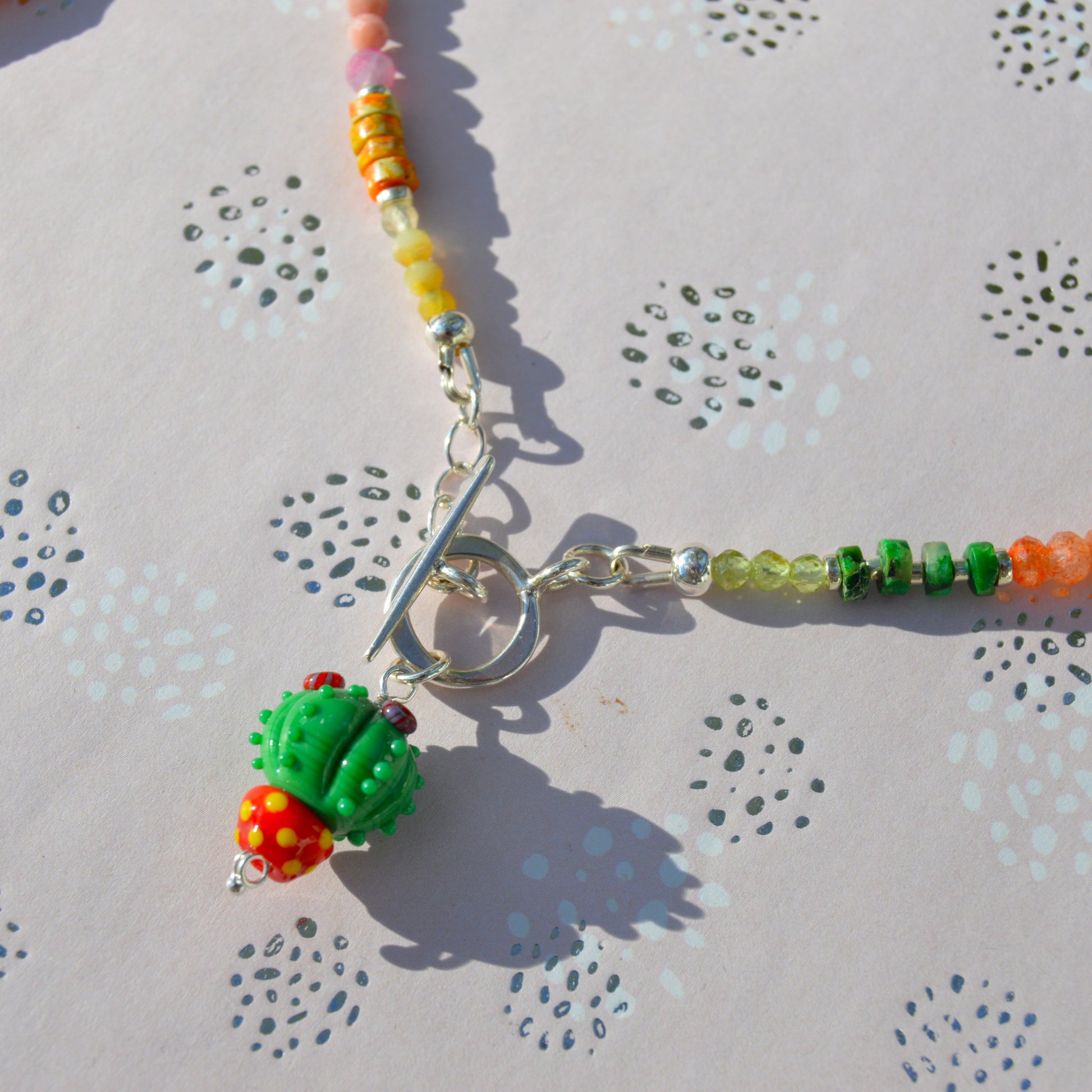 One of a kind sterling silver gemstone necklace with Blooming Cactus lampwork charm and toggle lock.