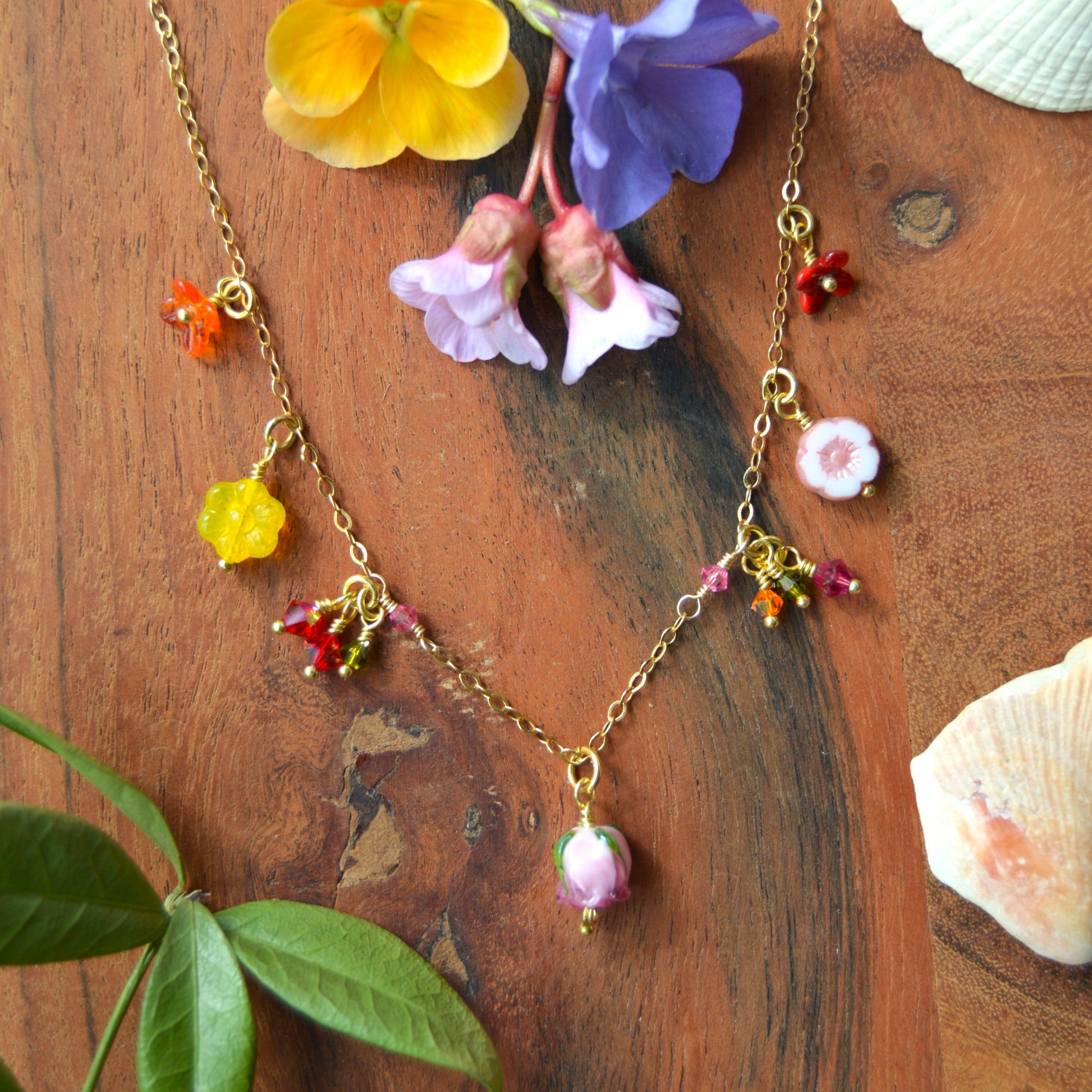 One of a kind gold-plated sterling silver necklace with glass flower & faceted bicones charms. Colourful. 