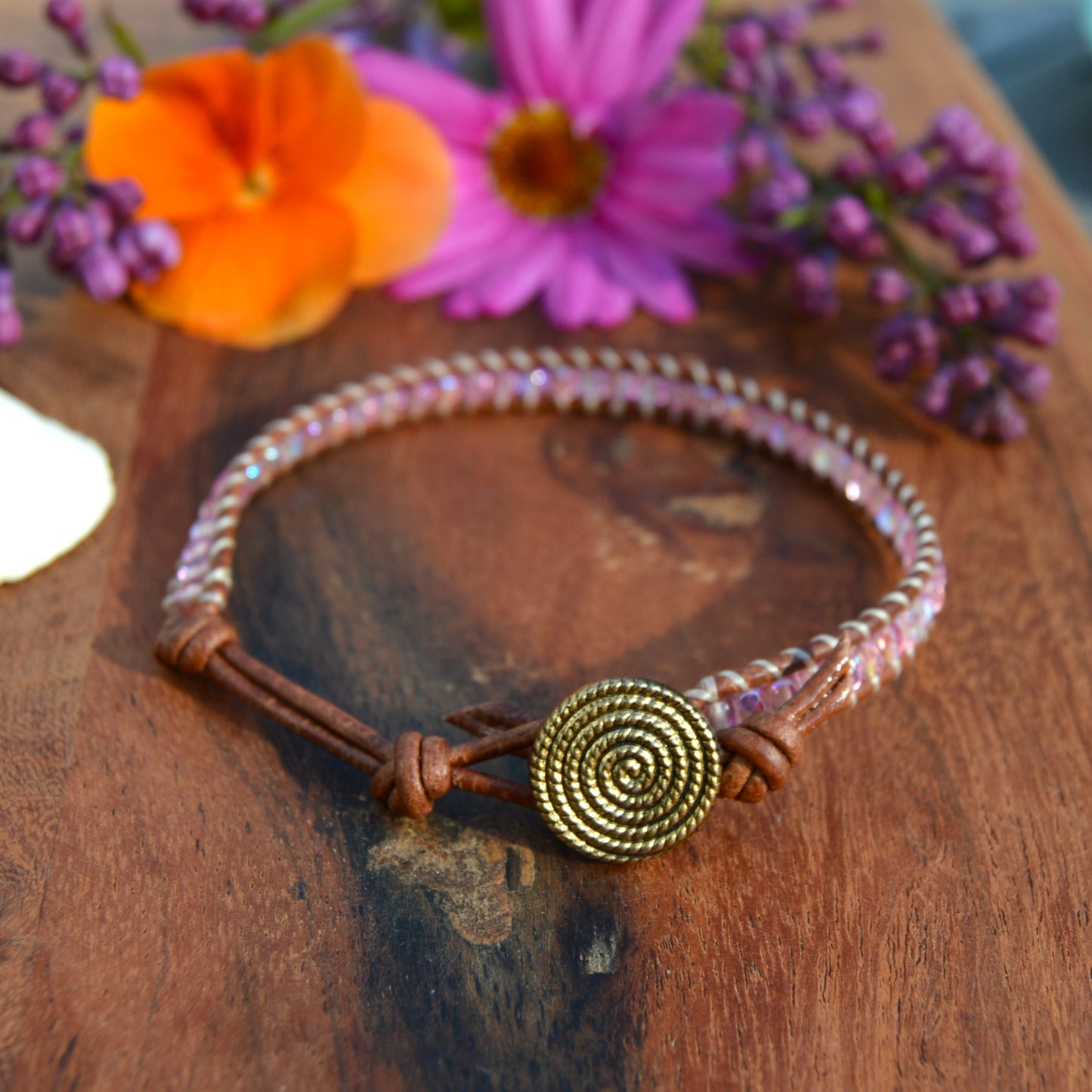 Leather wrap bracelet with Czech glass beads and a button as a lock.