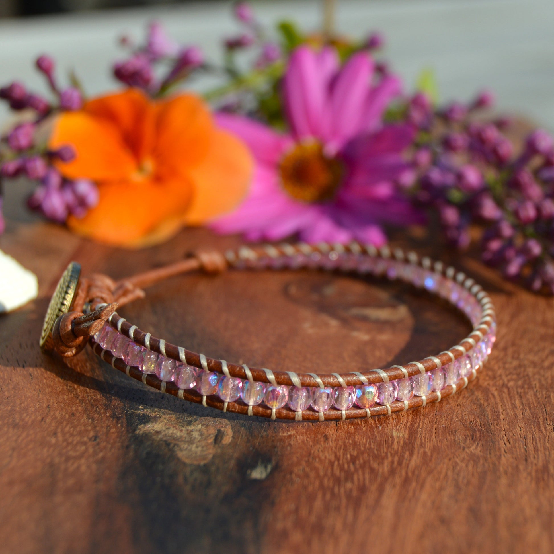 Leather wrap bracelet with Czech glass beads and a button as a lock.