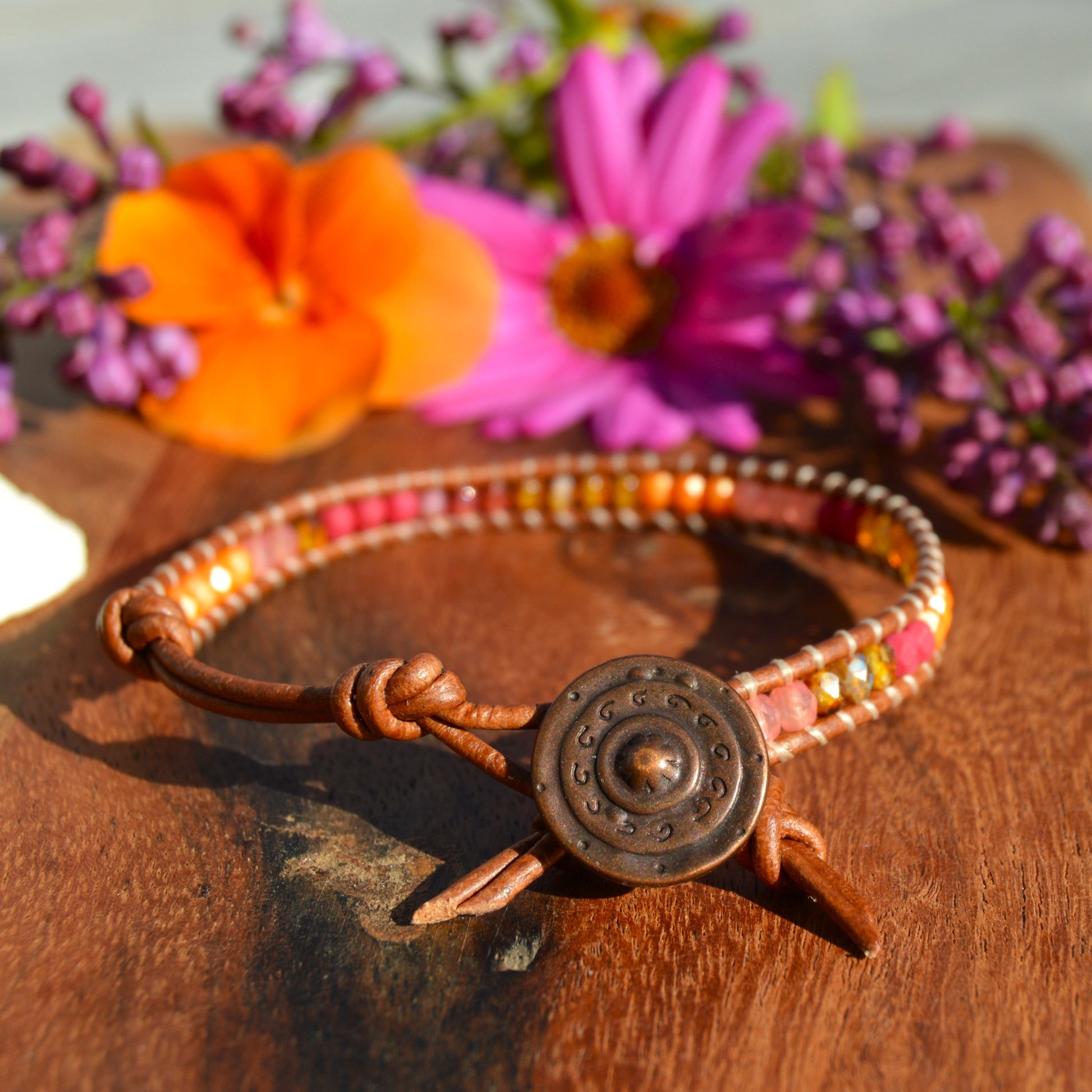 Leather wrap bracelet with Czech glass beads and a button as a lock.