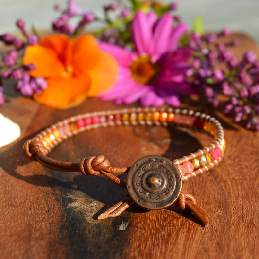 Leather wrap bracelet with Czech glass beads and a button as a lock.