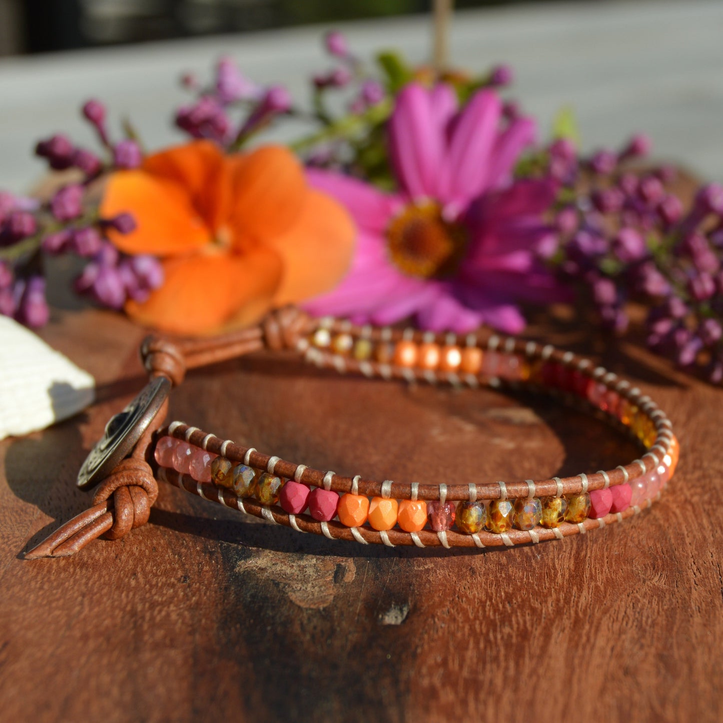 Leather wrap bracelet with Czech glass beads and a button as a lock.