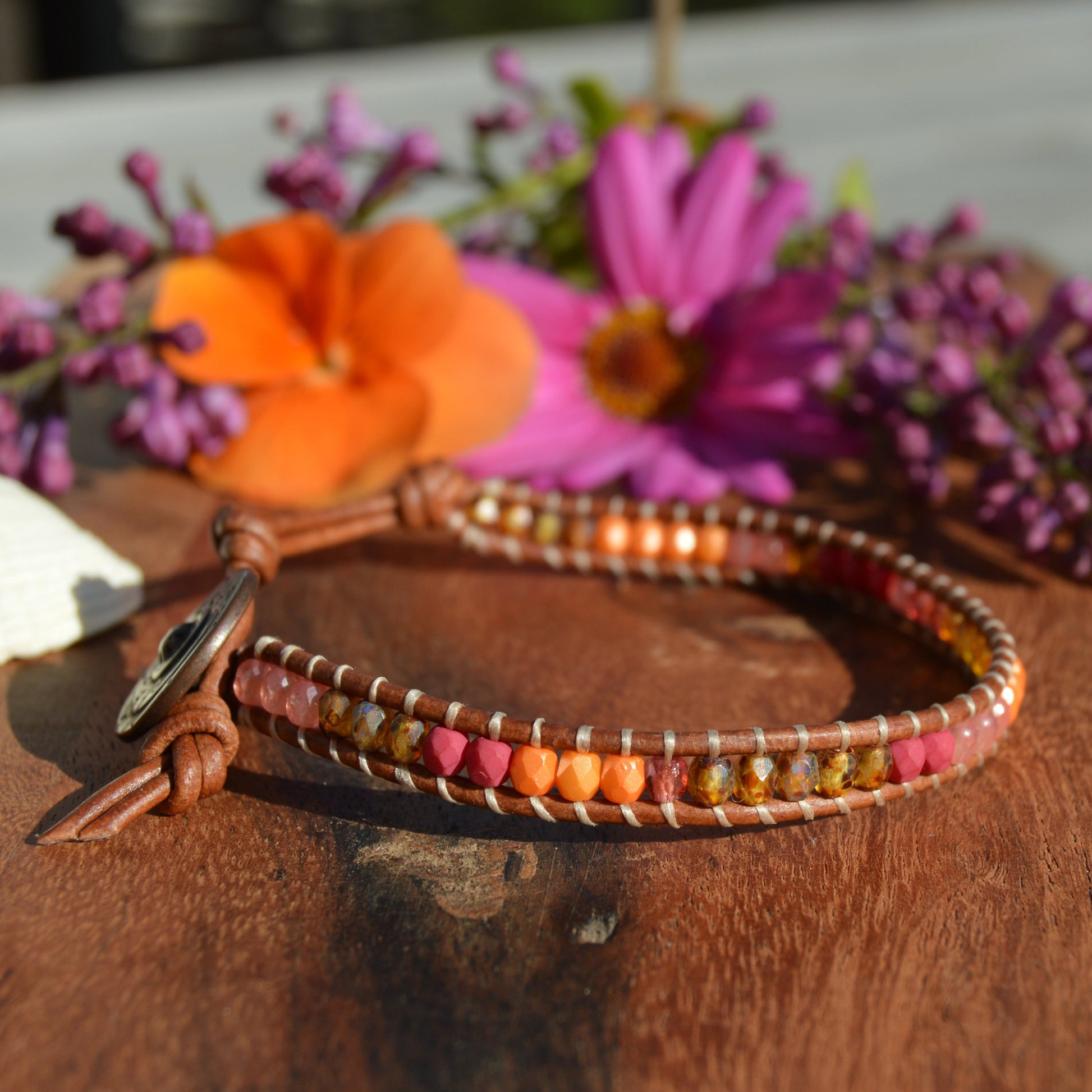 Leather wrap bracelet with Czech glass beads and a button as a lock.
