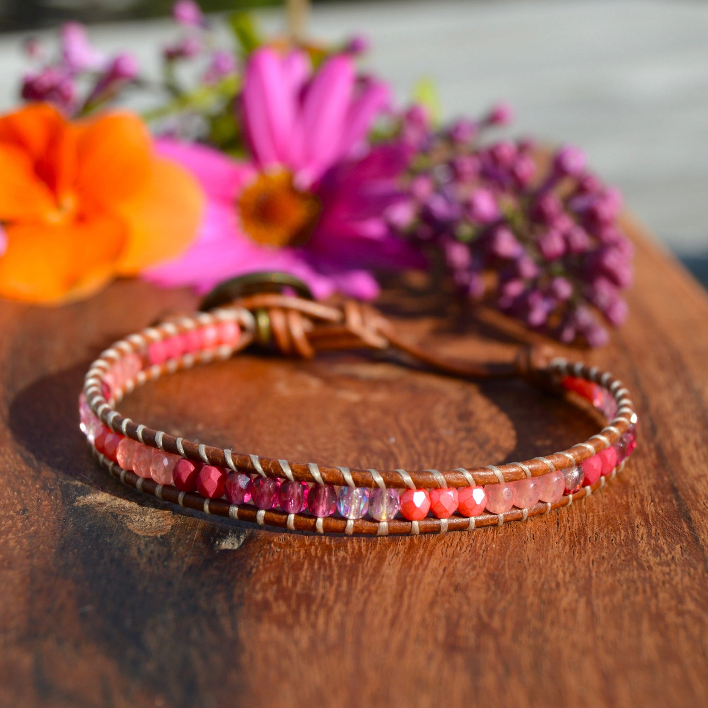 Leather wrap bracelet with Czech glass beads and a button as a lock.