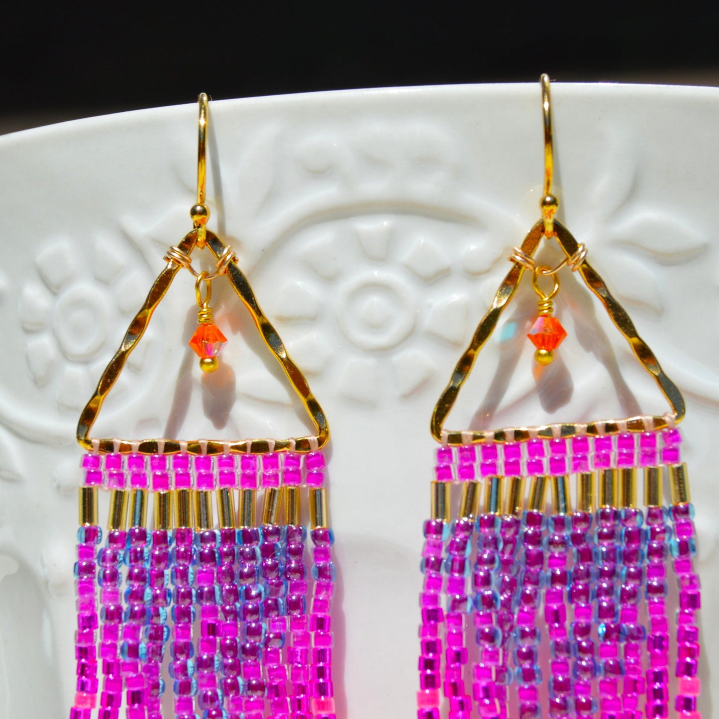 Small fringe earrings made of high-quality Japanese seed beads woven on gold-plated 925 sterling silver hammered triangles, decorated with Czech faceted glass bicones.