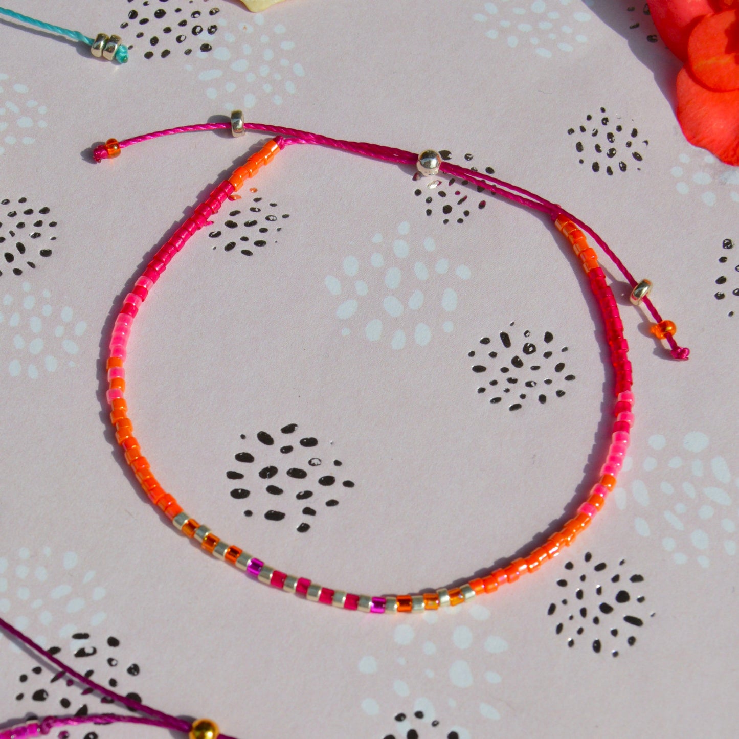 Adjustable beaded bracelet made of Japanese seed beads with silicon stopper bead.