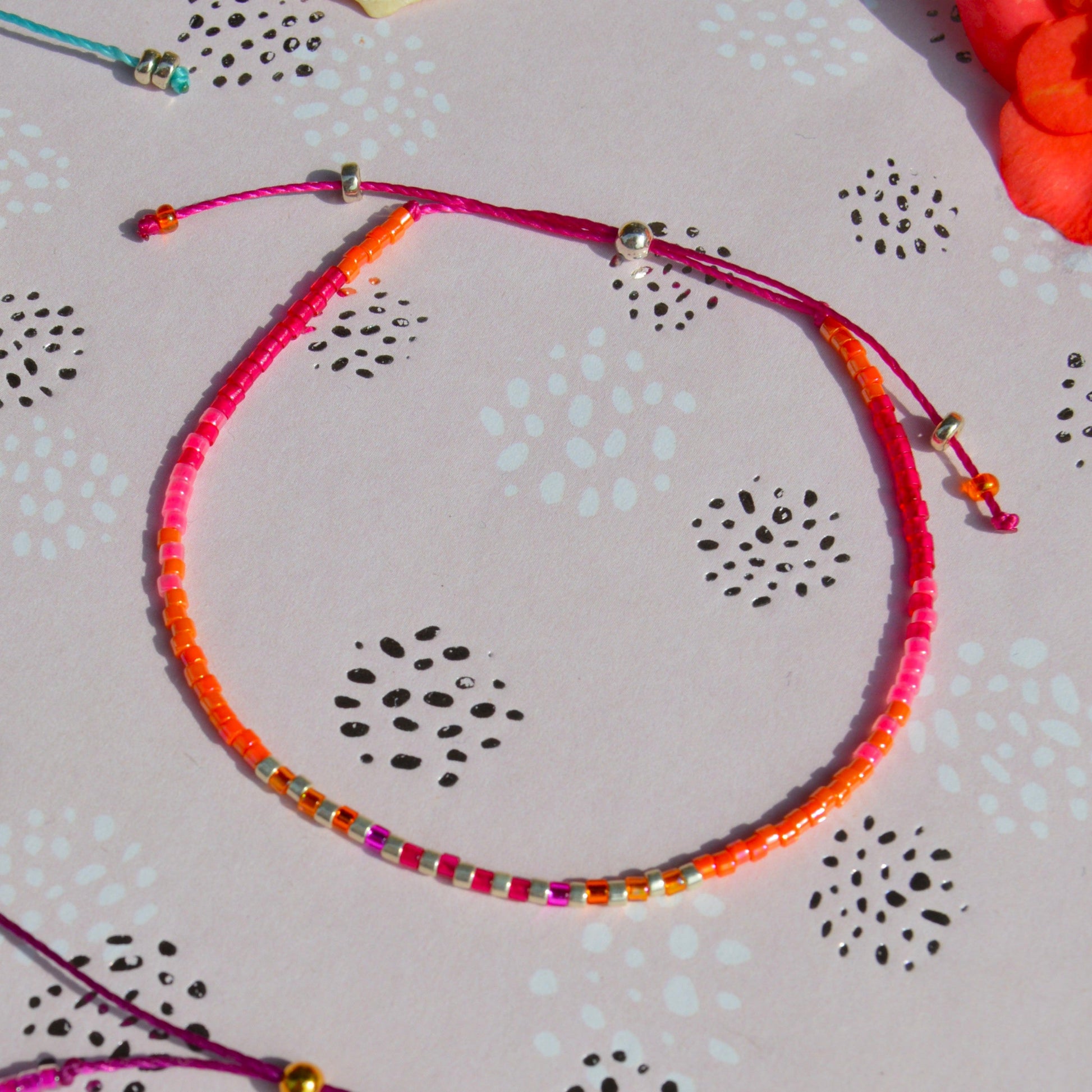 Adjustable beaded bracelet made of Japanese seed beads with silicon stopper bead.
