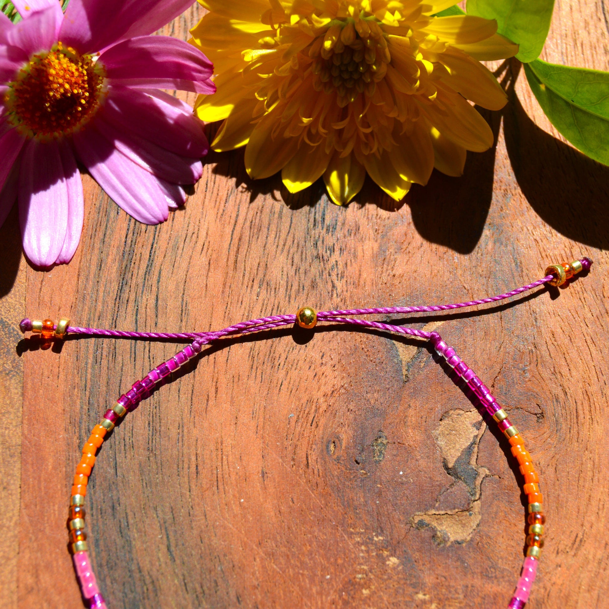 Adjustable, colourful beaded bracelet with silicone stopper bead.