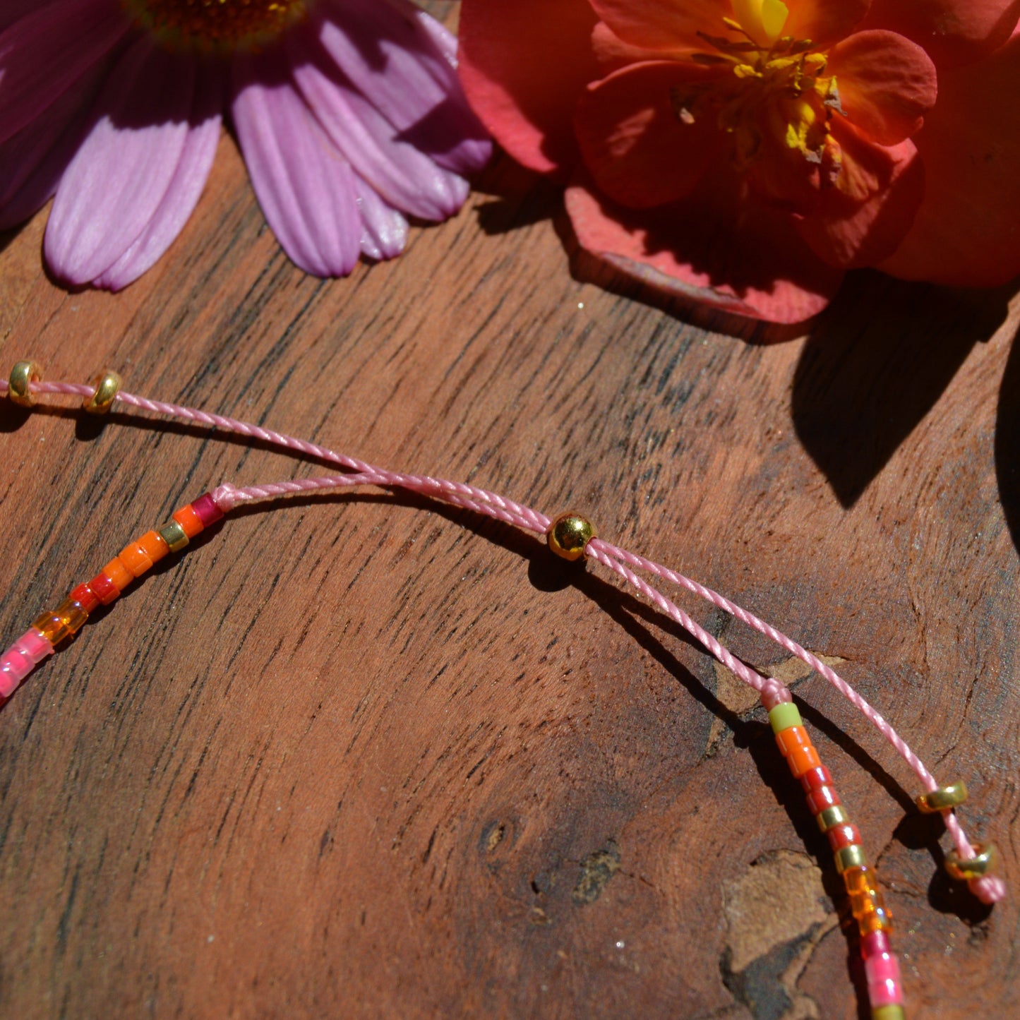 Adjustable, colourful beaded bracelet with silicone stopper bead.