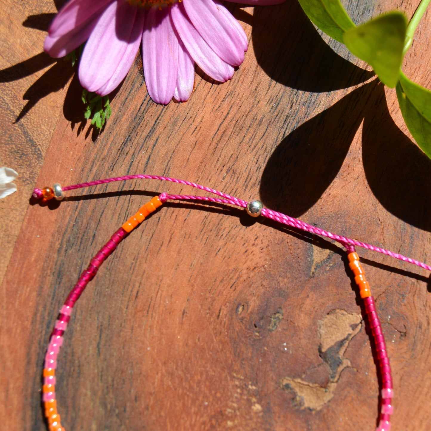 Adjustable beaded bracelet made of Japanese seed beads with silicon stopper bead.