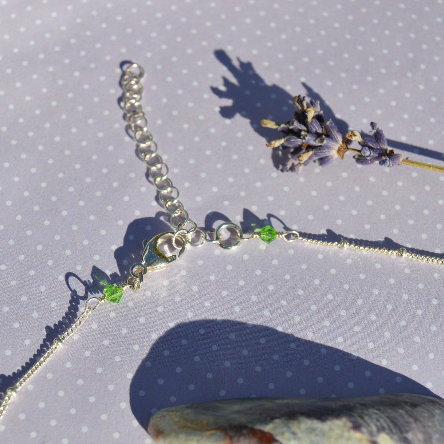 Beaded necklace with turtle charm in sterling silver. Extension chain with wired crystals.