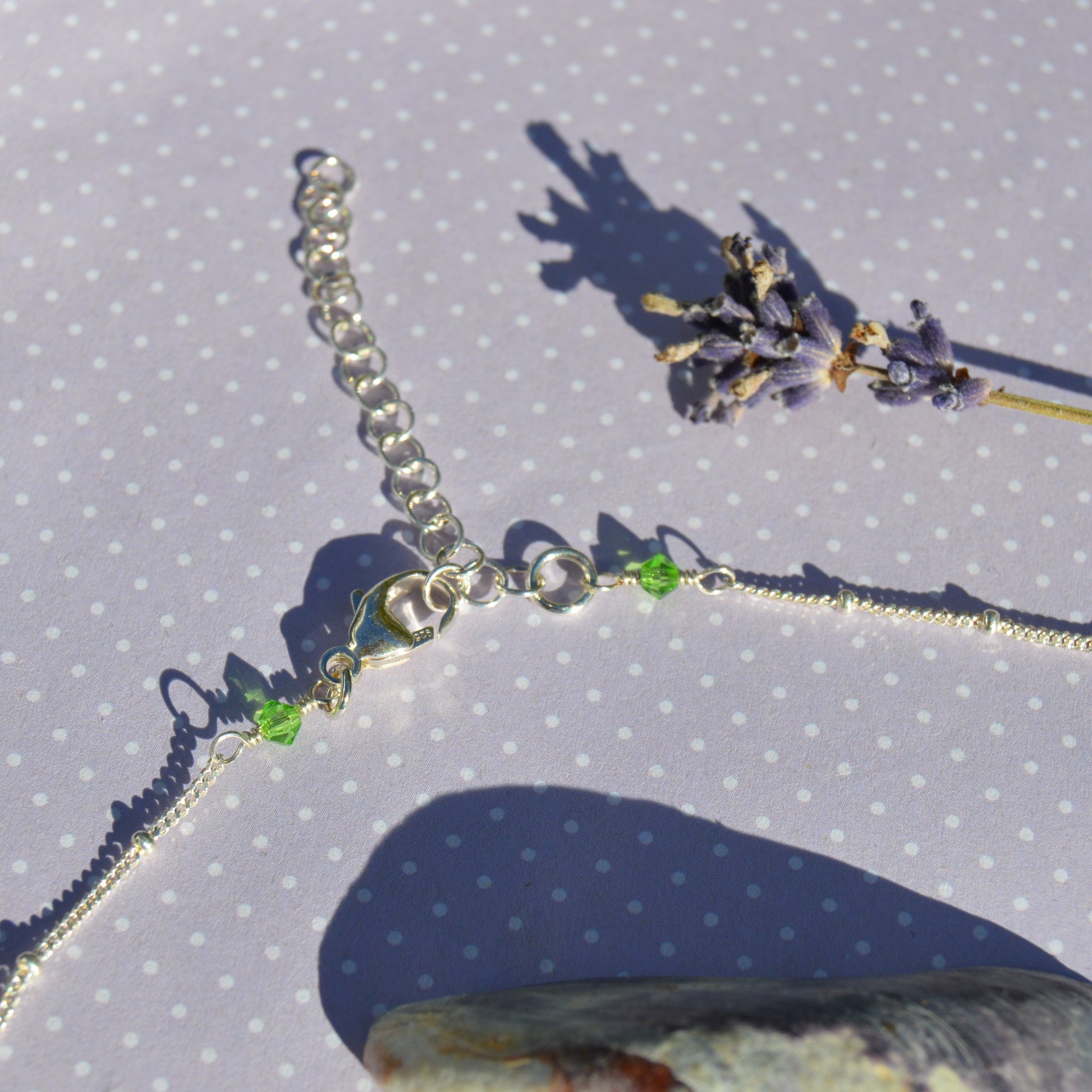 Beaded necklace with turtle charm in sterling silver. Extension chain with wired crystals.