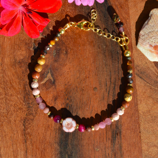 Gemstone bracelet in pink, beige, and brown town. Gold-plated sterling silver, and pink flower glass bead.