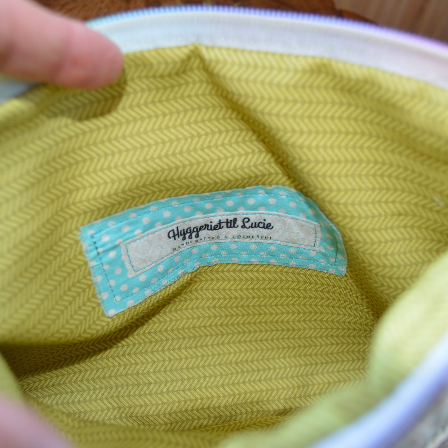 Mosaic crochet clutch handbag Falling Into Bricks with colourful lining.