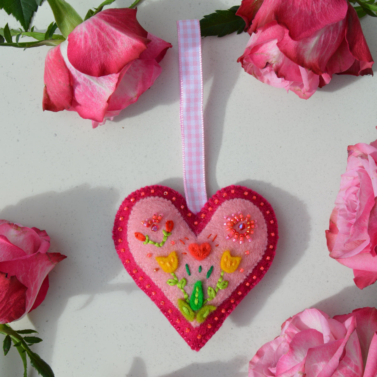 Embroidered Wool Folklore Heart with flower motif, decorated with glass seed beads.