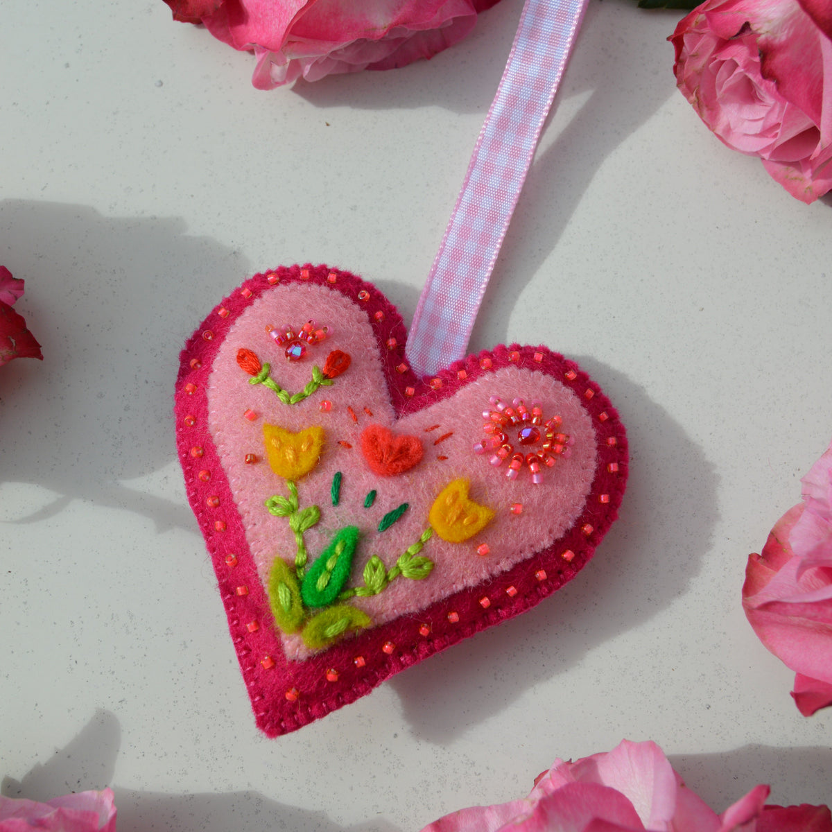 Embroidered Wool Folklore Heart with flower motif, decorated with glass seed beads.