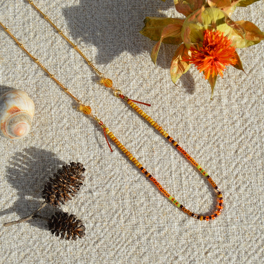 Necklace Closer to the Earth made of Japanese and Czech seed beads and Czech faceted glass crystals. Woven on a nylon thread attached to gold-plated sterling silver chain. Delicate and bohemian.