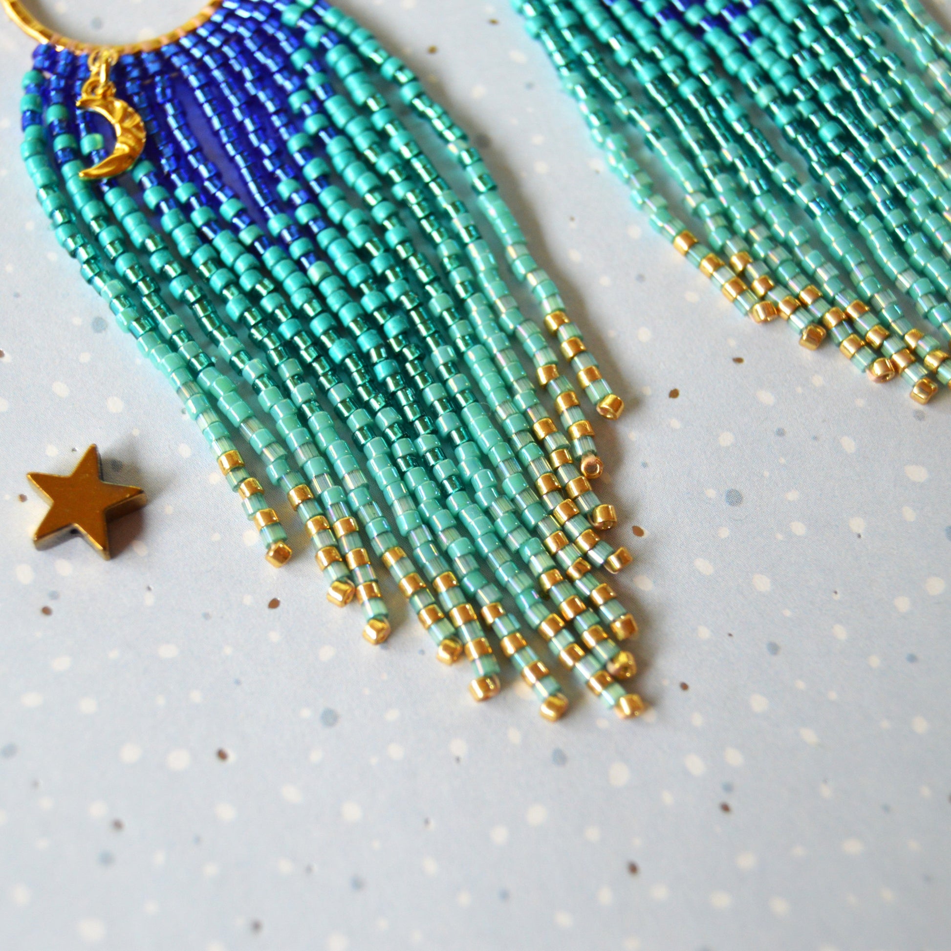 Dreamy beaded fringe earrings with moon charmm.