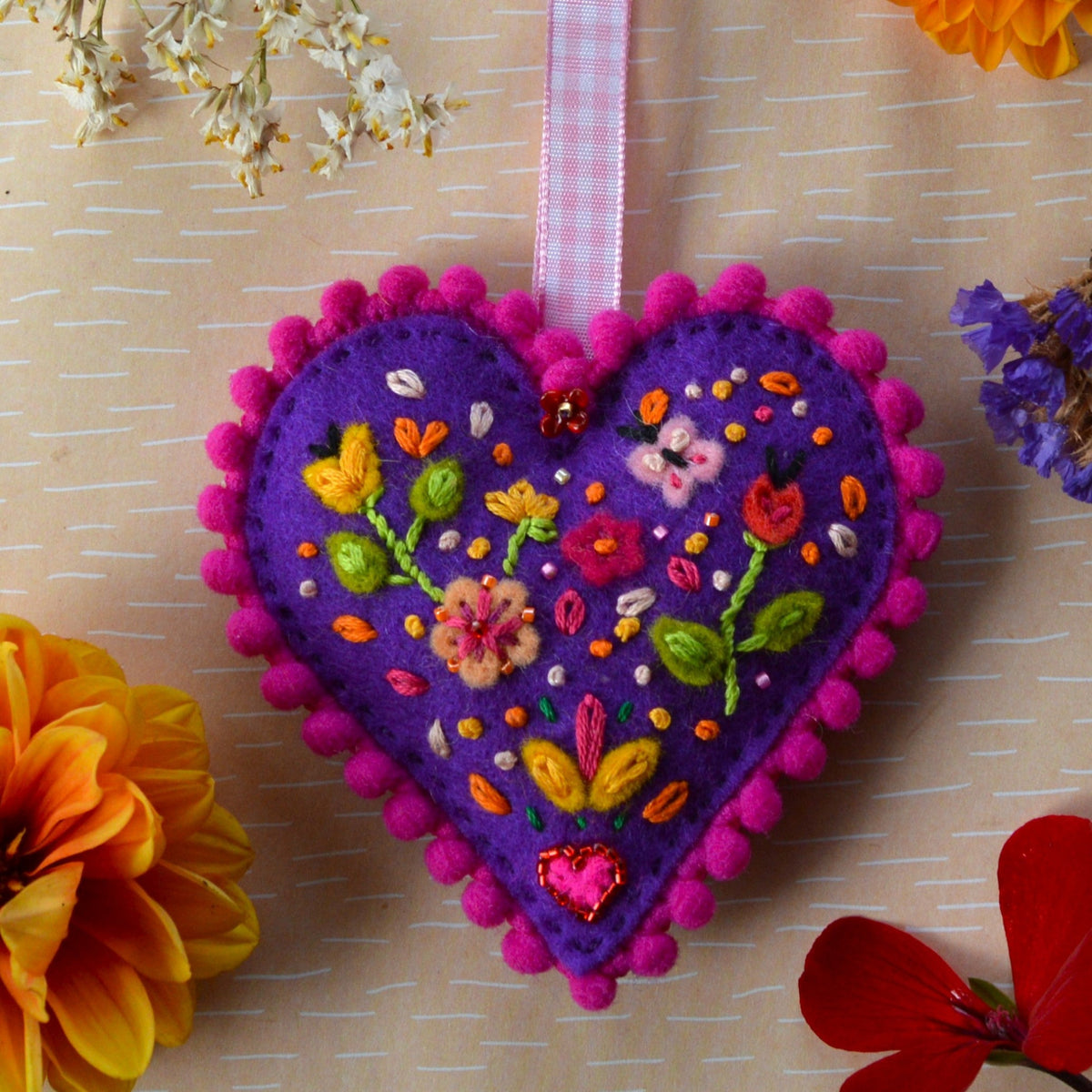 Embroidered Wool Folklore Heart with flower motif, decorated with glass seed beads.