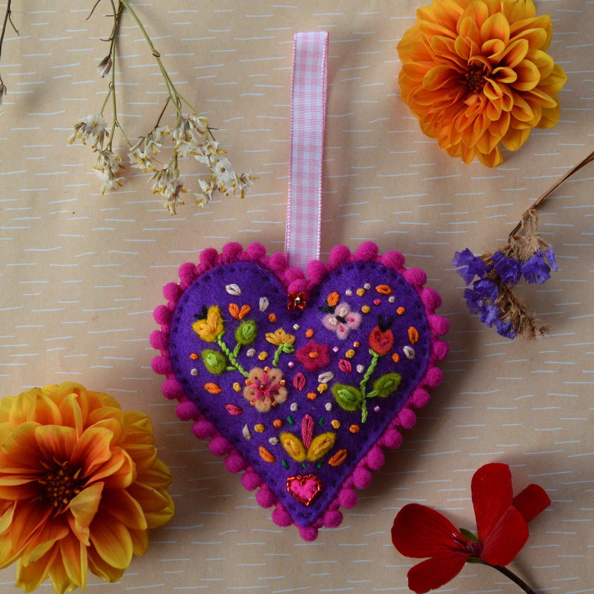 Embroidered Wool Folklore Heart with flower motif, decorated with glass seed beads.