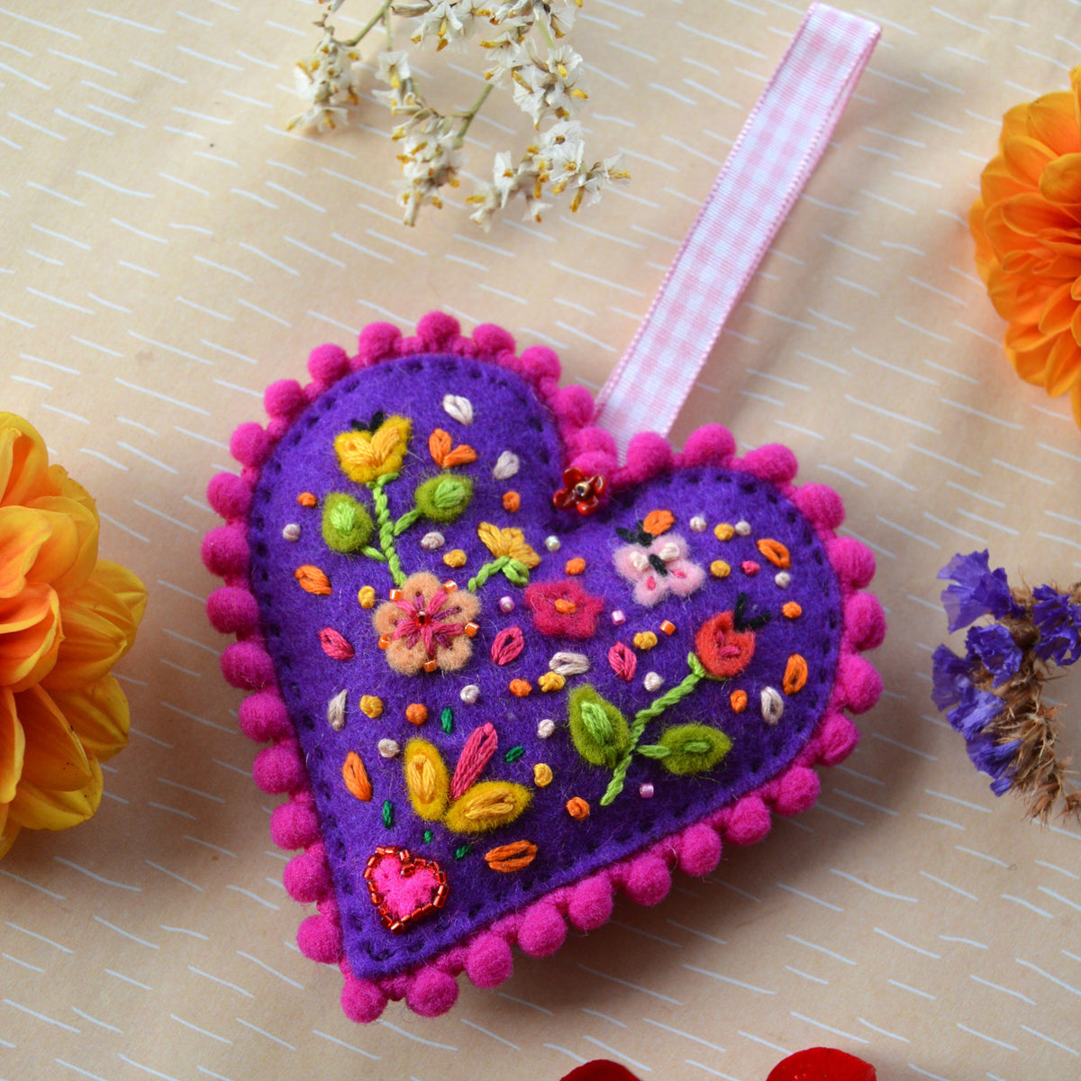 Embroidered Wool Folklore Heart with flower motif, decorated with glass seed beads.
