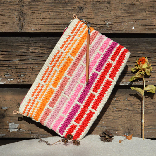Crochet cotton Clutch Handbag Falling into Bricks.
