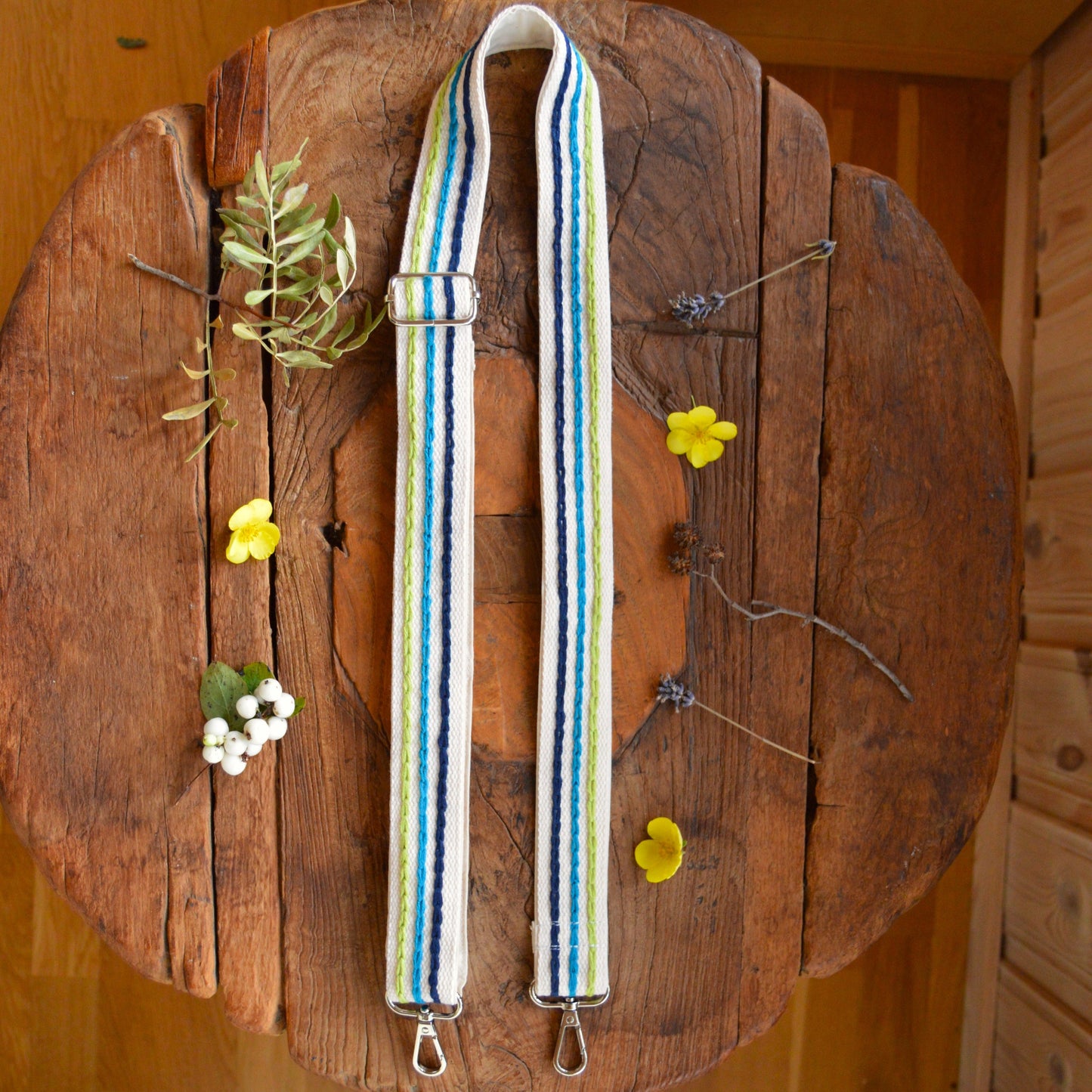 Colourful adjustable embroidery strap.