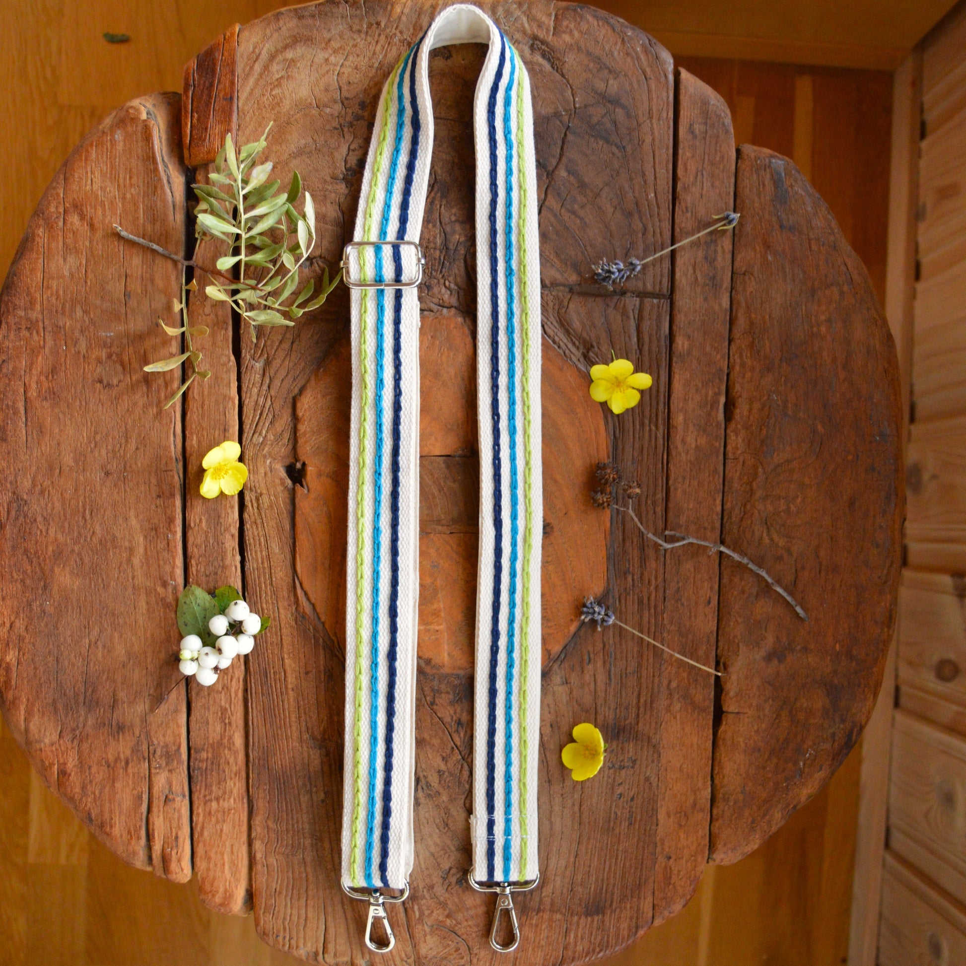 Colourful adjustable embroidery strap.