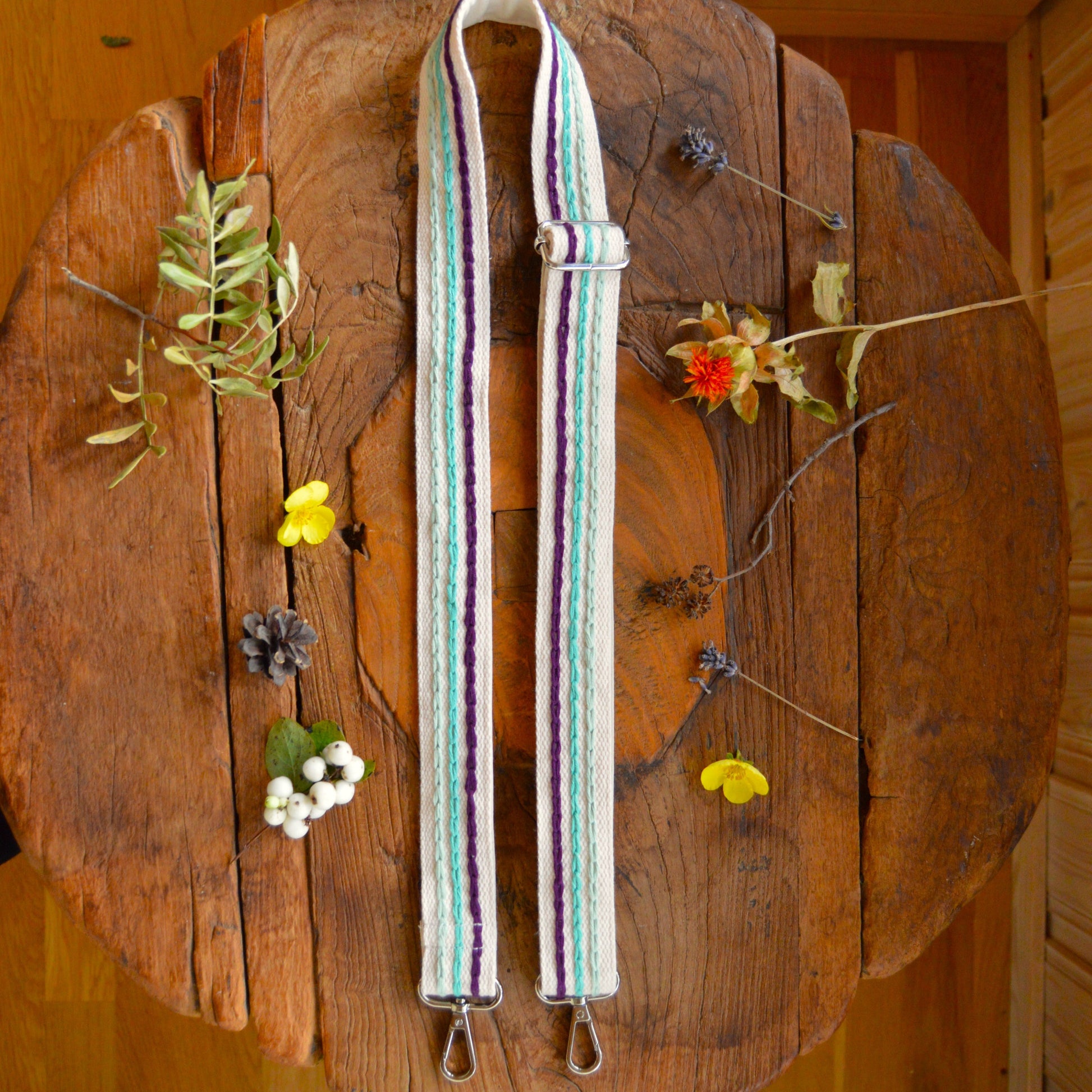 Colourful adjustable embroidered strap.