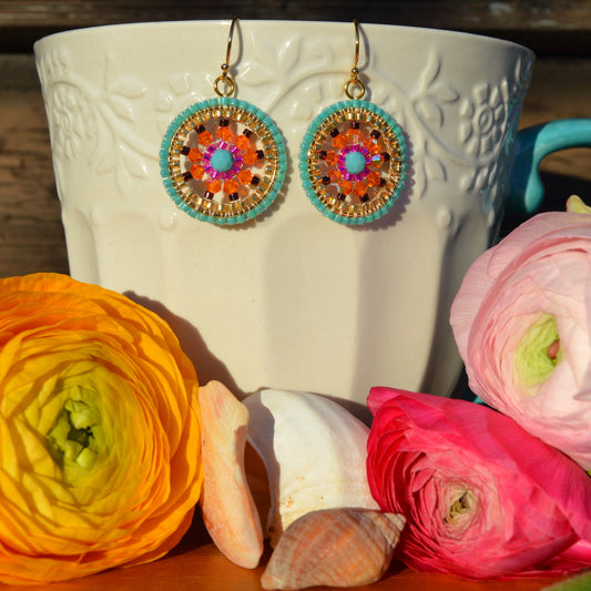 Woven Czech crystals earrings in turquoise, orange and cerise pink. Gold-plated sterling silver.