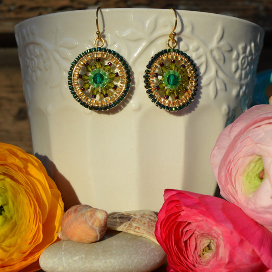Woven earrings made of Czech faceted glass crystals and Japanese seed beads. Gold-plated sterling silver.