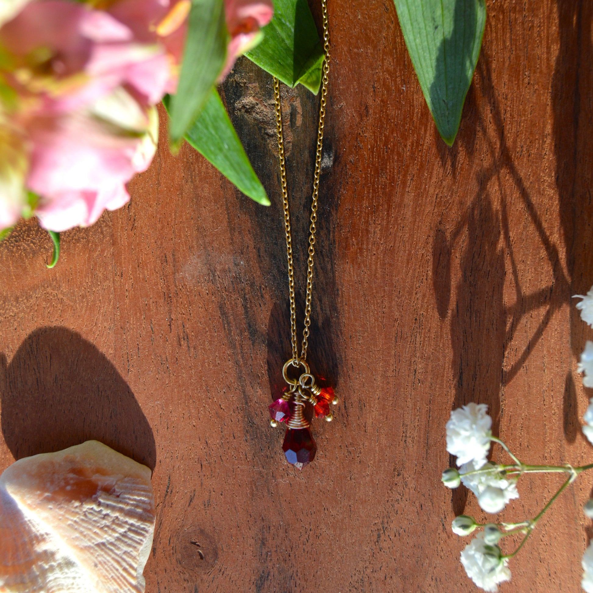 Gold-plated sterling silver necklace with small cluster of Premium Czech glass bicones and wire-wrapped drop.