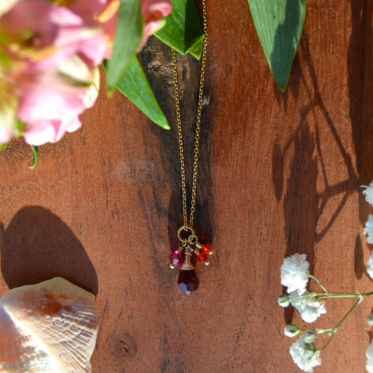 Gold-plated sterling silver necklace with small cluster of Premium Czech glass bicones and wire-wrapped drop.