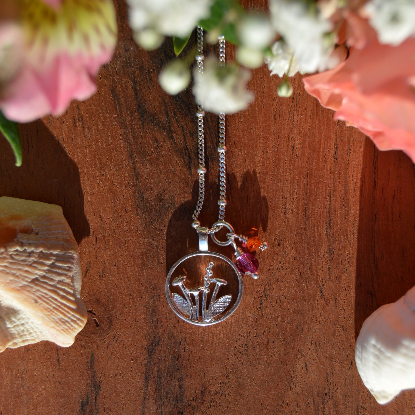 Sterling silver necklace with flower charm and Czech premium faceted glass beads. 