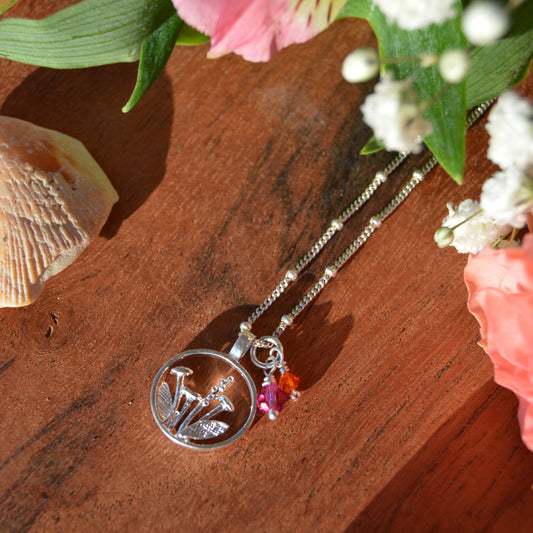 Sterling silver necklace with flower charm and Czech premium faceted glass beads. 