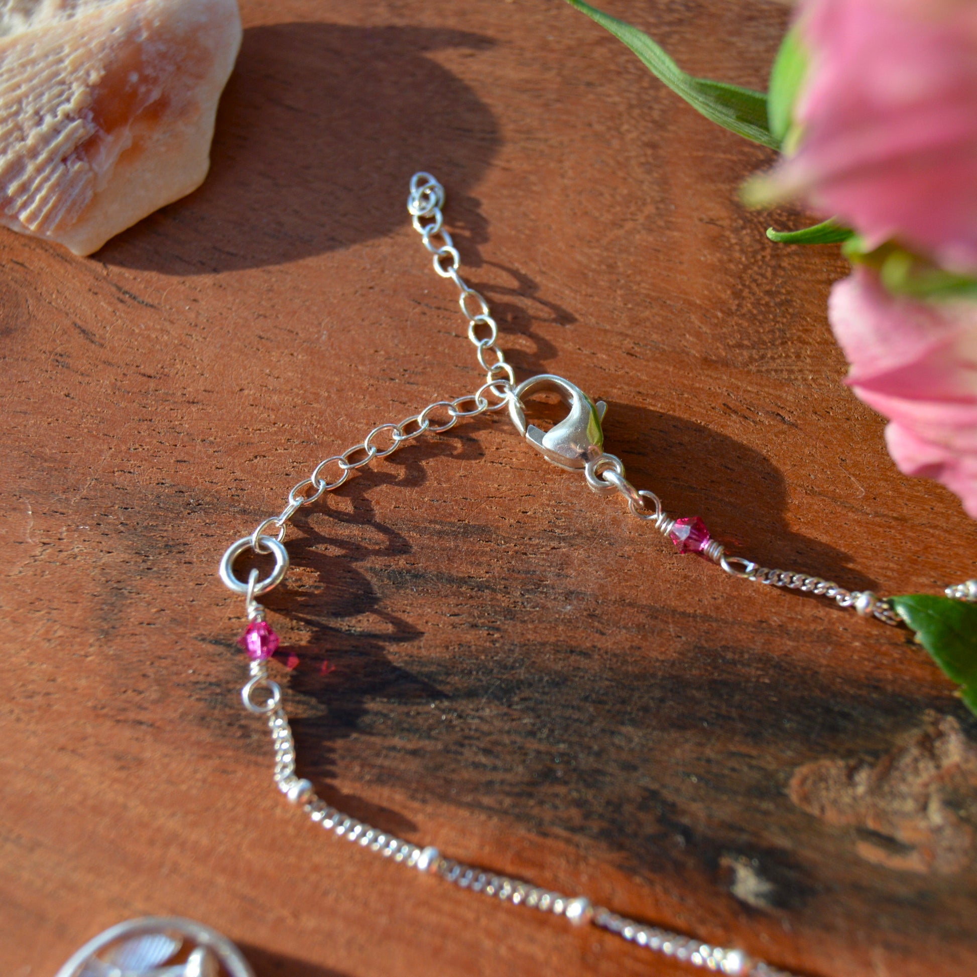 Sterling silver necklace with flower charm and Czech premium faceted glass beads. Extension chain.