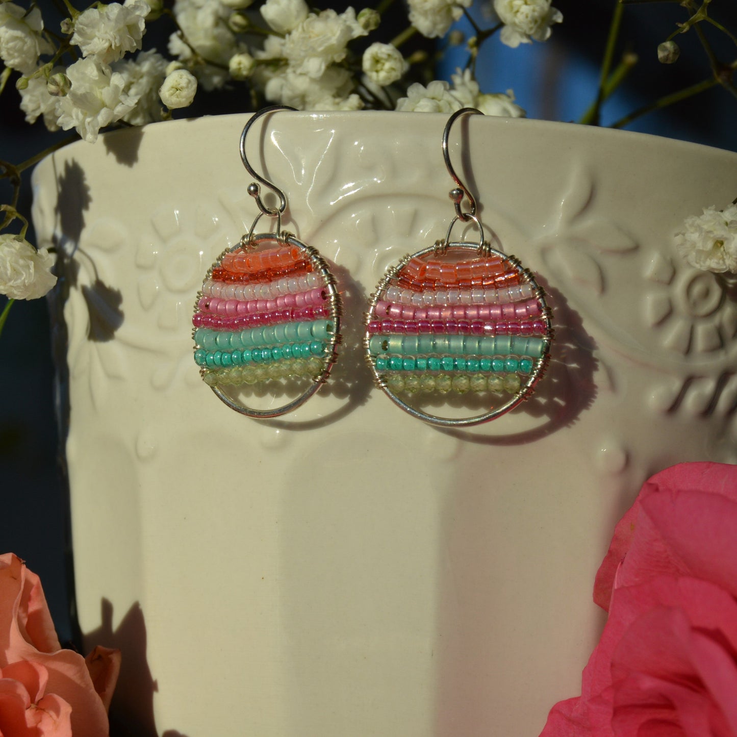 Sterling silver hoops in light, pastel colours wire-wrapped with gemstones and Japanese glass seed beads.