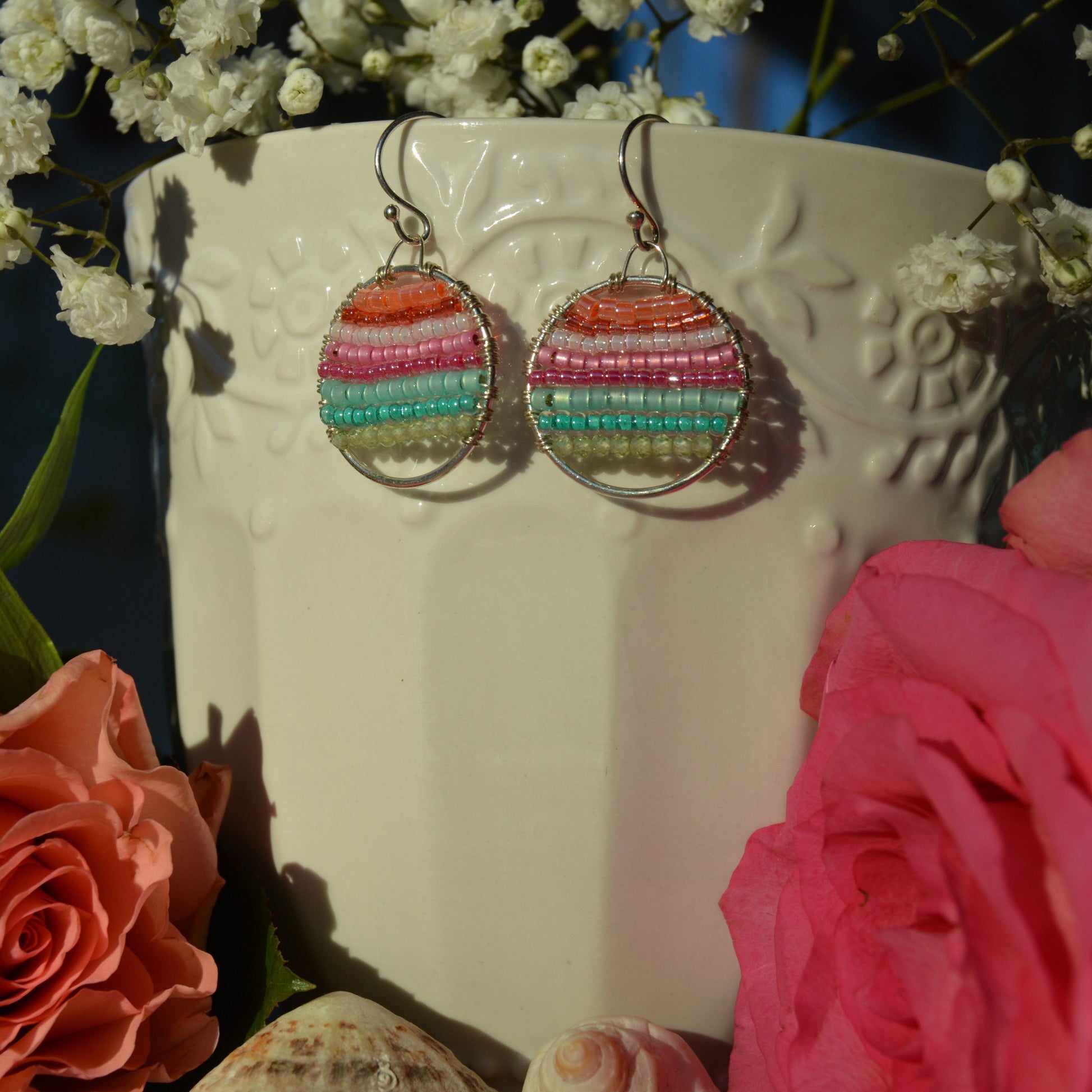 Sterling silver hoops in light, pastel colours wire-wrapped with gemstones and Japanese glass seed beads.